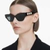 Solbriller i Cat-Eye-form, sort