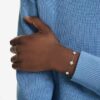 Una Angelic-armbånd med runde, dobbeltsidede motiver, hvidt, rhodiumbelagt Una Angelic-armbånd med runde, dobbeltsidede motiver, hvidt, rhodiumbelagt