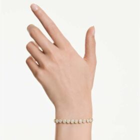Una Angelic armbånd med runde krystaller, hvidt, guldbelagt Una Angelic armbånd med runde krystaller, hvidt, guldbelagt